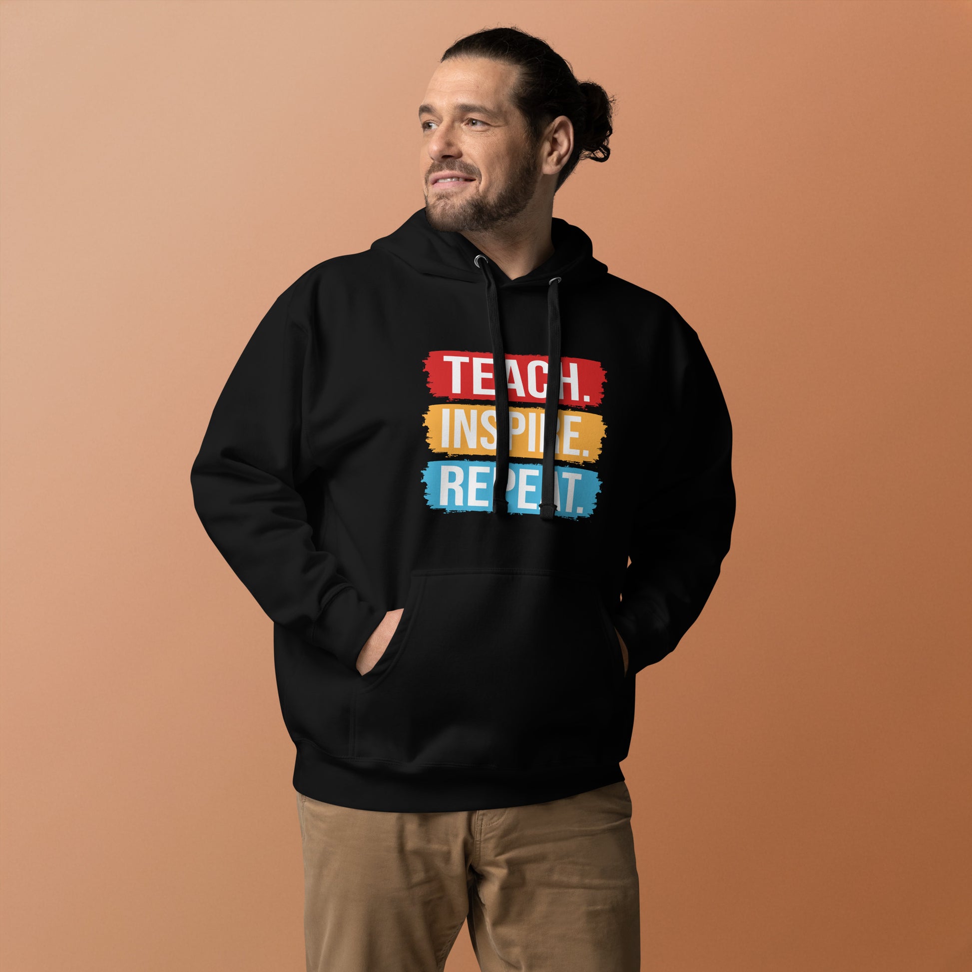 Unisex hoodie with ‘Teach. Inspire. Repeat.’ text design — WYVibe teacher hoodie.