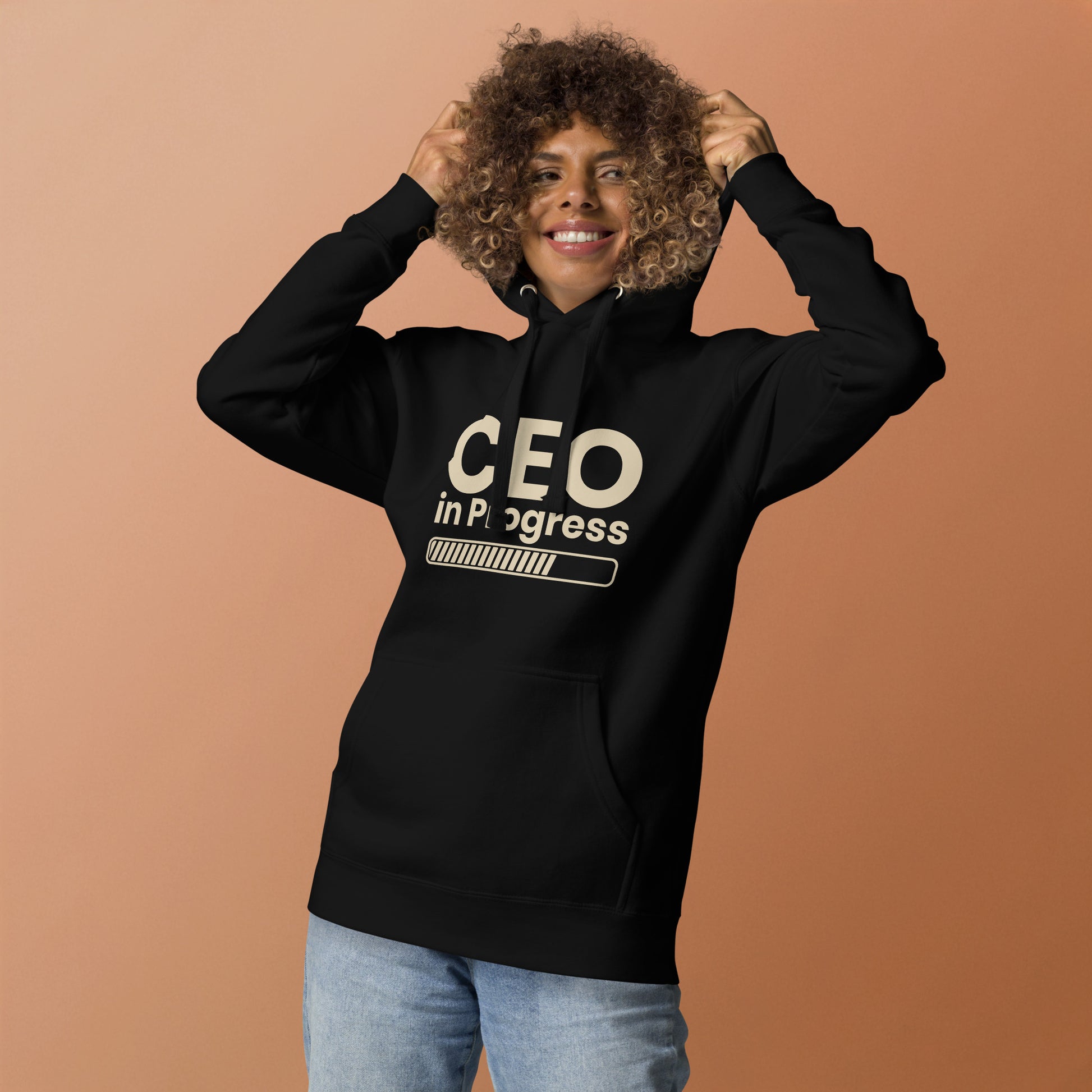 Unisex hoodie with ‘CEO in Progress’ text graphic — WYVibe entrepreneur streetwear hoodie.