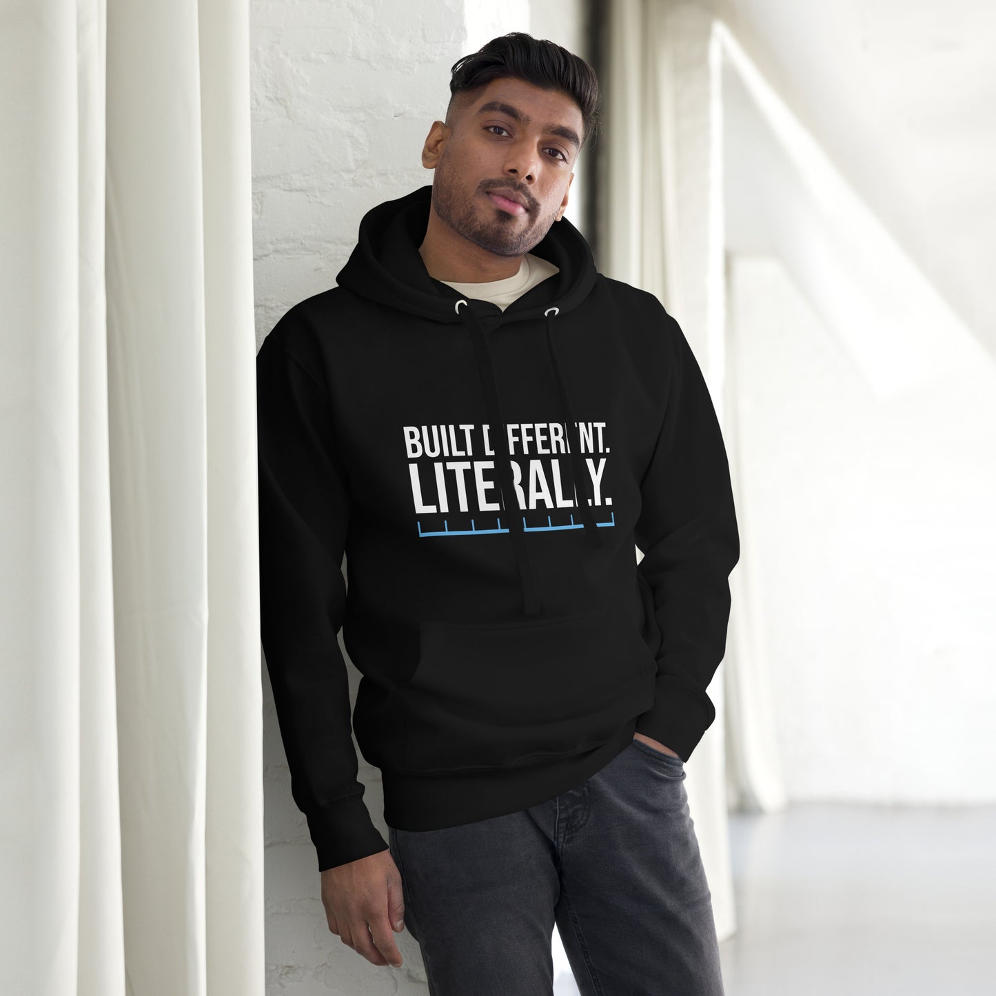 Unisex hoodie with ‘Built Different. Literally.’ text design — WYVibe motivational hoodie.