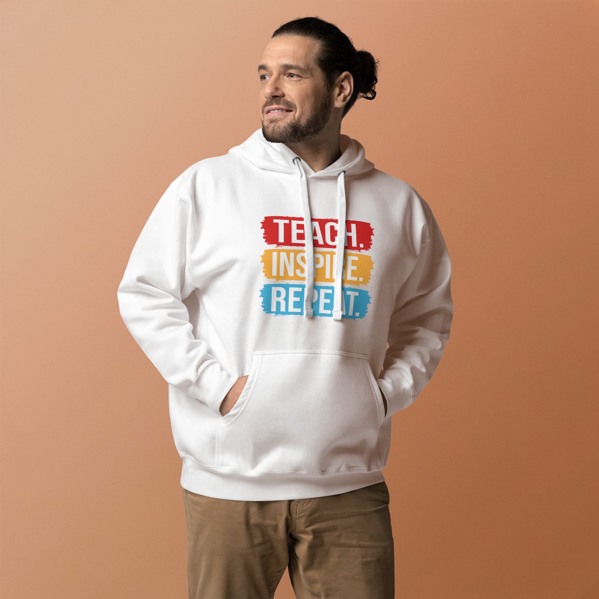 Unisex hoodie with ‘Teach. Inspire. Repeat.’ text design — WYVibe teacher hoodie.