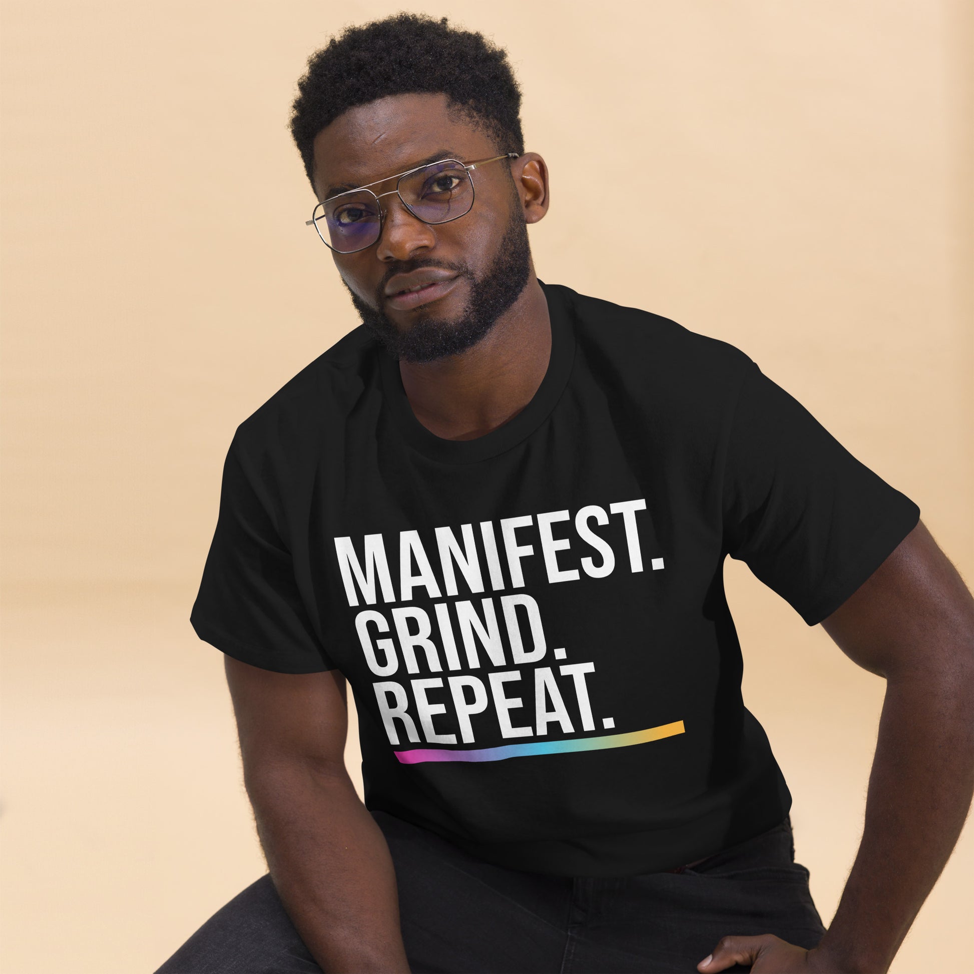 Unisex entrepreneurial t-shirt with ‘Manifest. Grind. Repeat.’ motivational design — WYVibe premium tee.