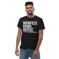 Unisex entrepreneurial t-shirt with ‘Manifest. Grind. Repeat.’ motivational design — WYVibe premium tee.