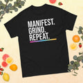 Unisex entrepreneurial t-shirt with ‘Manifest. Grind. Repeat.’ motivational design — WYVibe premium tee.