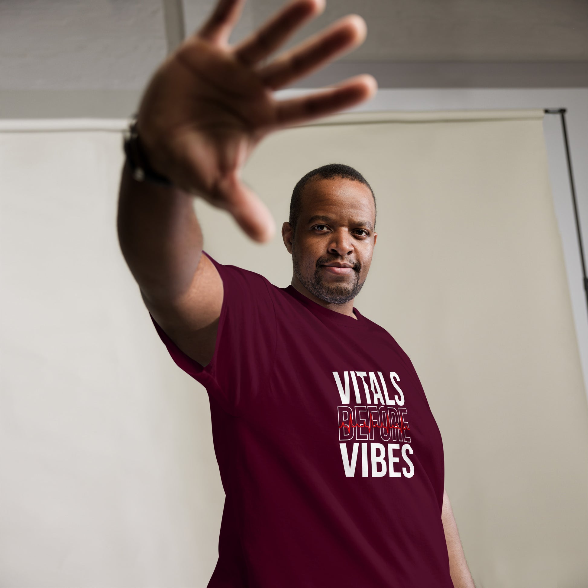 Unisex medical-themed t-shirt with ‘Vitals Before Vibes’ design — WYVibe nurse tee.